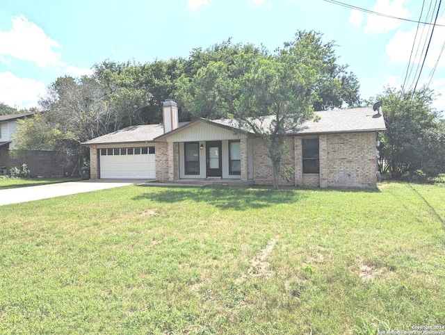 ranch-style house featuring a front yard and a garage