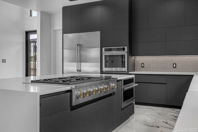 kitchen with tasteful backsplash and stainless steel appliances