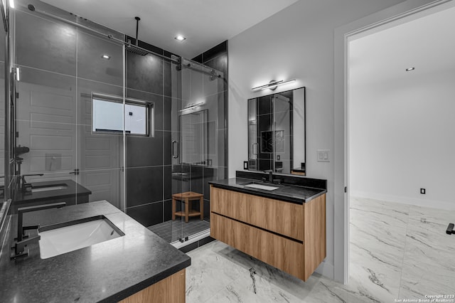 bathroom featuring vanity and a shower with door