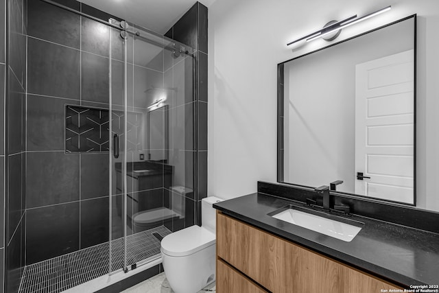 bathroom featuring walk in shower, vanity, and toilet