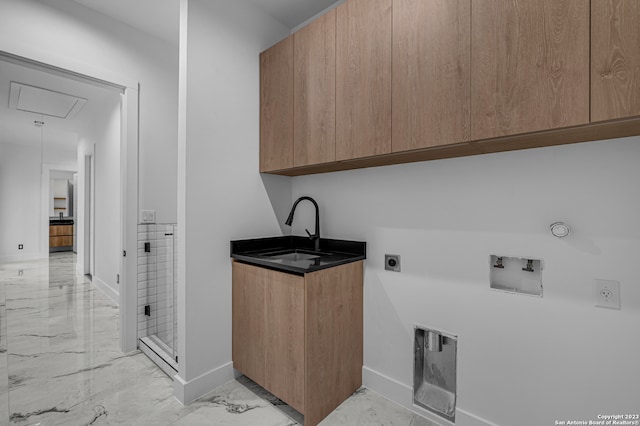 laundry area featuring electric dryer hookup, cabinets, hookup for a gas dryer, sink, and hookup for a washing machine