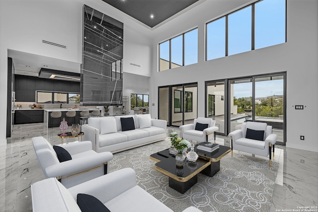 living room with a towering ceiling