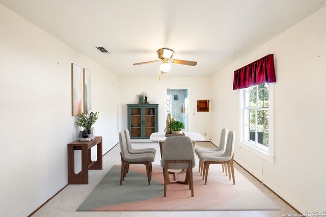 dining room featuring ceiling fan