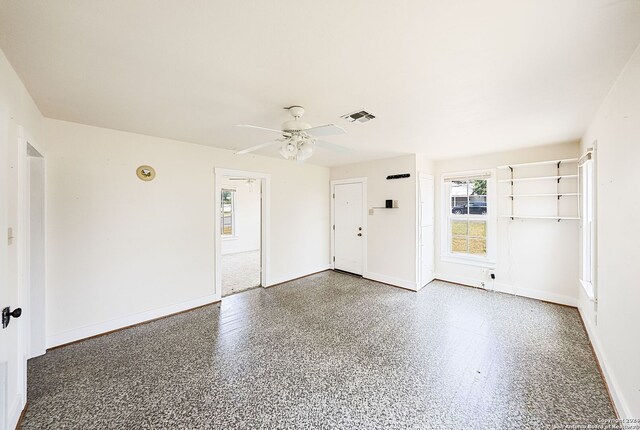 spare room with ceiling fan