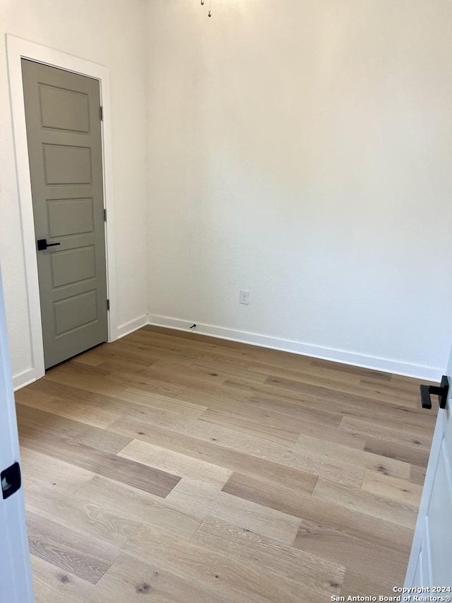 spare room with light wood-type flooring