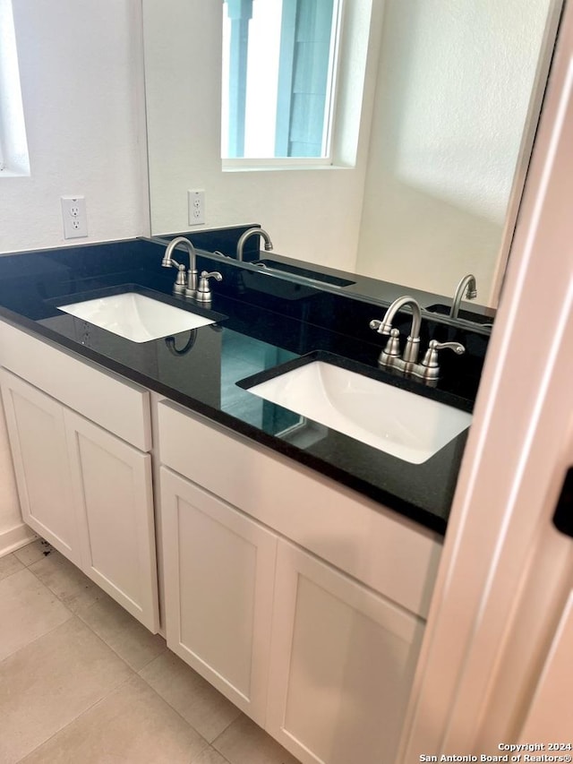 bathroom with vanity and tile patterned floors