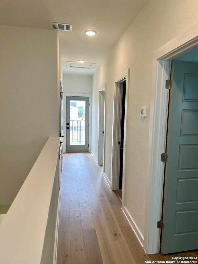 hall featuring light hardwood / wood-style flooring