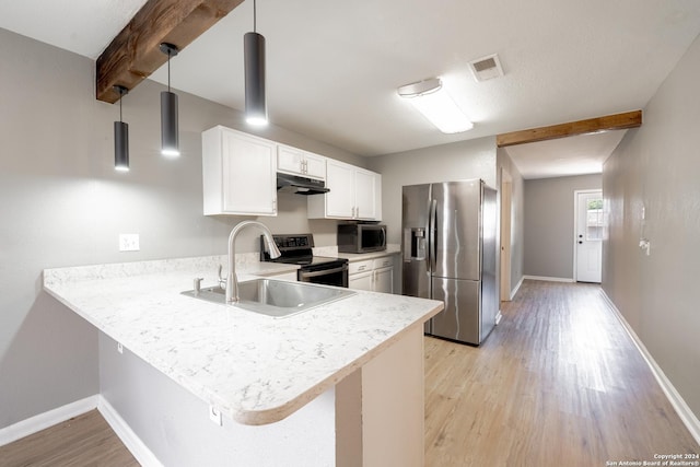 kitchen featuring a peninsula, visible vents, hanging light fixtures, appliances with stainless steel finishes, and light countertops