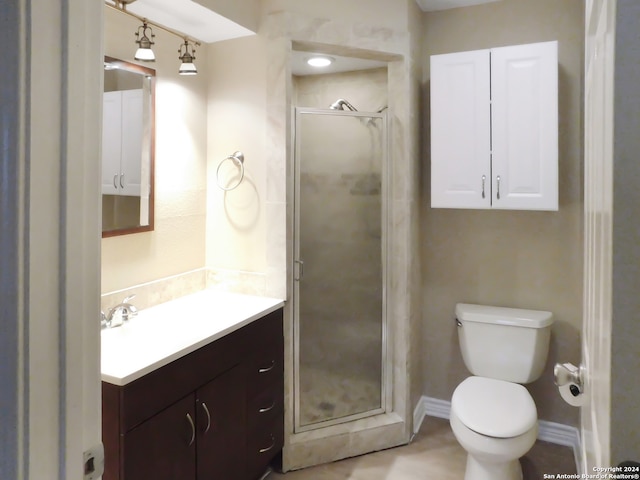 bathroom with vanity, toilet, and walk in shower