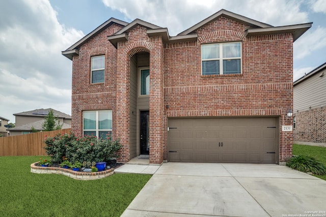 front facade with a front yard and a garage