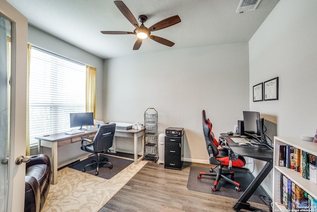 office area featuring light hardwood / wood-style flooring and ceiling fan