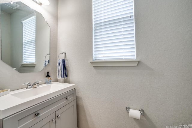 bathroom featuring plenty of natural light and vanity