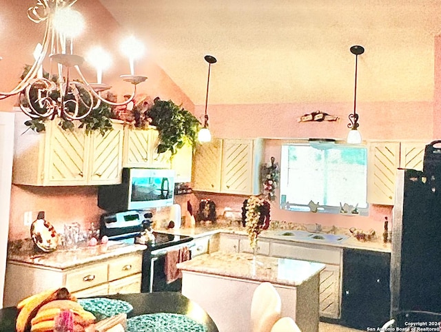 kitchen with white appliances, sink, cream cabinets, a center island, and lofted ceiling