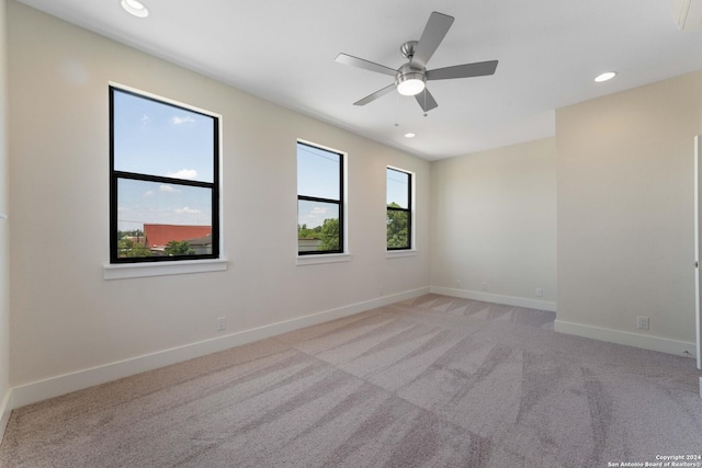 carpeted empty room with ceiling fan