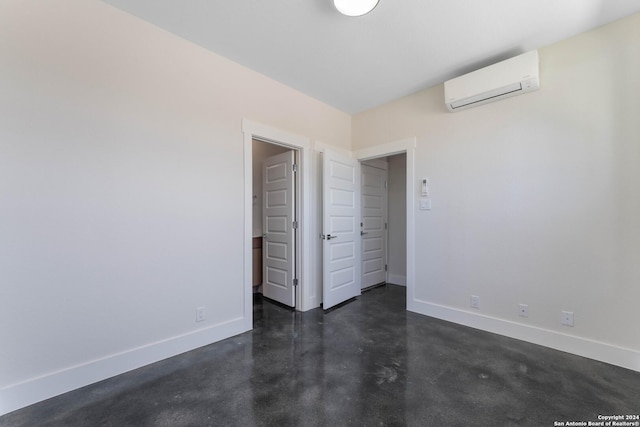 unfurnished bedroom with an AC wall unit