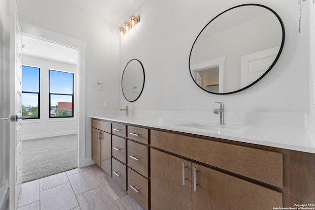 bathroom with tile patterned flooring and vanity