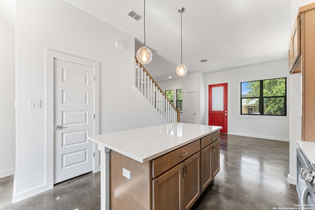 kitchen with decorative light fixtures and a kitchen island