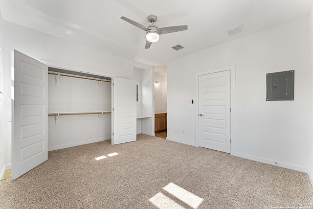 unfurnished bedroom featuring light carpet, a closet, and ceiling fan