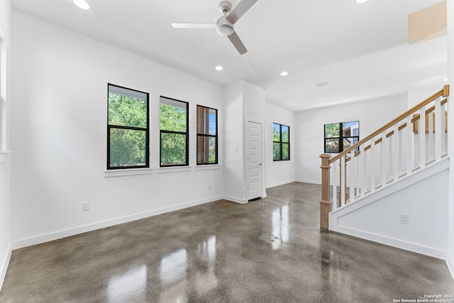 foyer entrance featuring ceiling fan