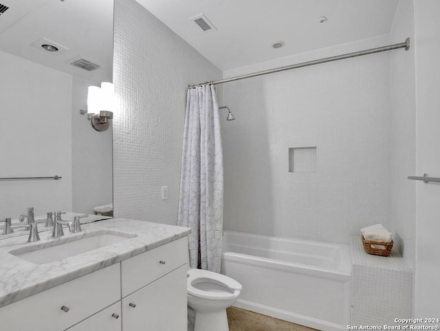 full bathroom featuring vanity, shower / bath combination with curtain, and toilet