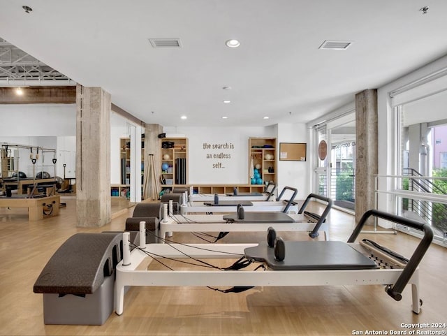 gym featuring light hardwood / wood-style floors