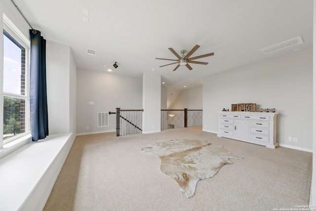 unfurnished room with light carpet and ceiling fan