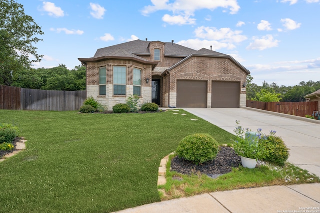 french country inspired facade with a front lawn and a garage