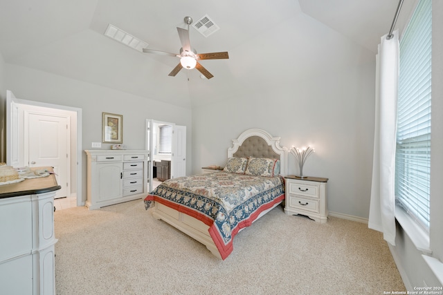 carpeted bedroom featuring ceiling fan and vaulted ceiling