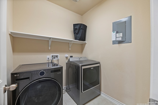 washroom featuring washer and dryer and electric panel