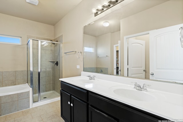 bathroom with tile patterned flooring, vanity, and shower with separate bathtub