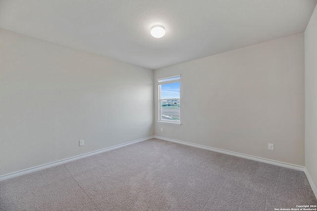 spare room with carpet flooring