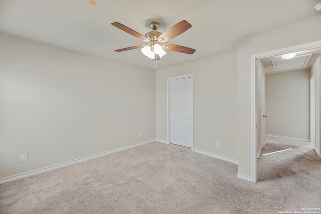 unfurnished bedroom featuring light carpet and ceiling fan