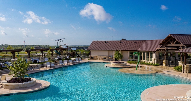 view of swimming pool featuring a patio