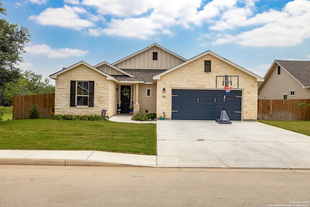 view of front of home featuring a garage and a front lawn