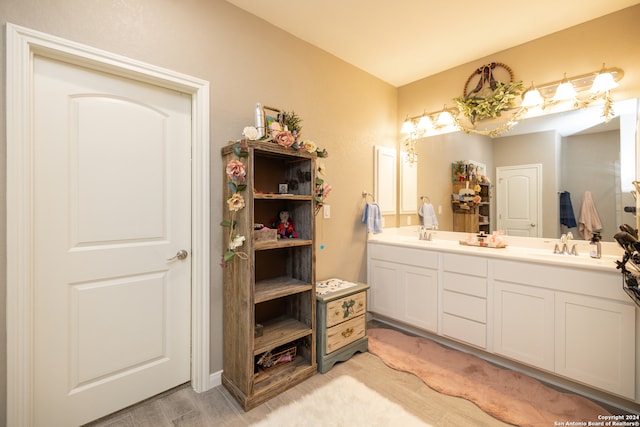 bathroom with dual sinks and large vanity