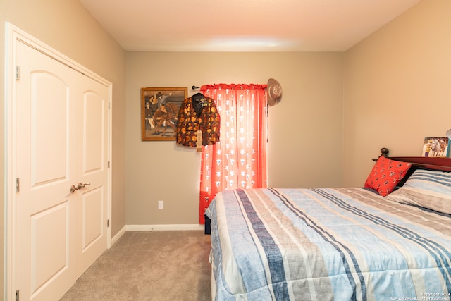 carpeted bedroom featuring a closet