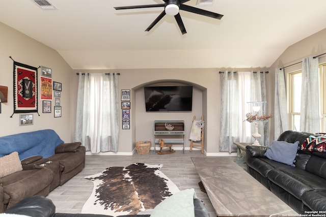 living room with ceiling fan, lofted ceiling, and wood-type flooring