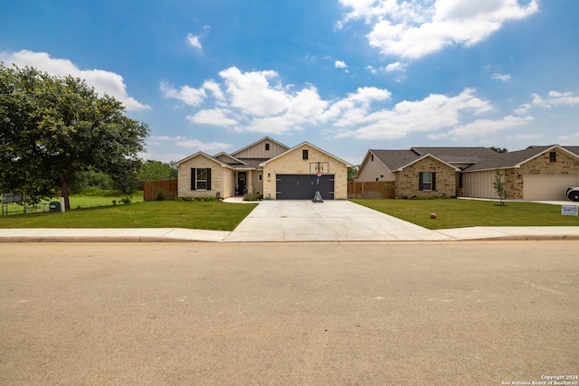 view of front of house with a front lawn and a garage