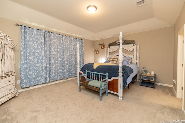 bedroom featuring vaulted ceiling and carpet flooring