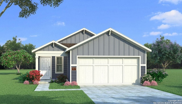 view of front of home featuring a front yard and a garage