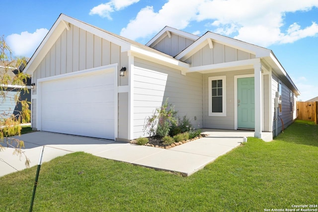 view of front facade with a garage and a front lawn