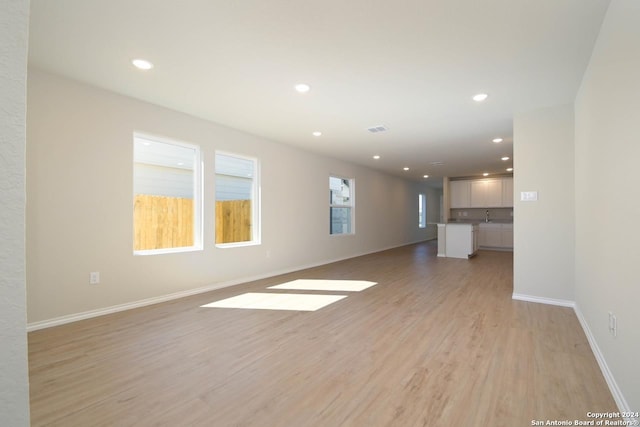 empty room with light hardwood / wood-style floors