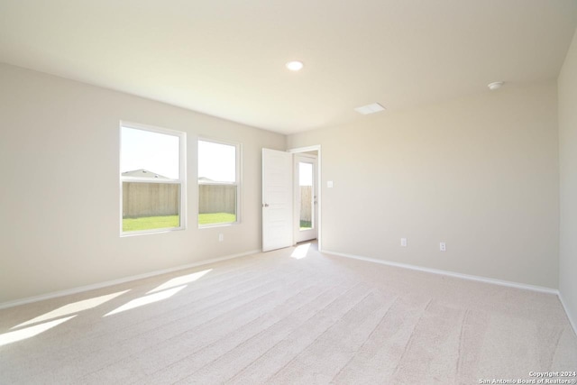 unfurnished room with light carpet