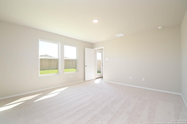 unfurnished room with light colored carpet