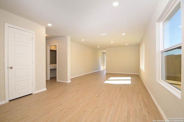 spare room with light hardwood / wood-style floors