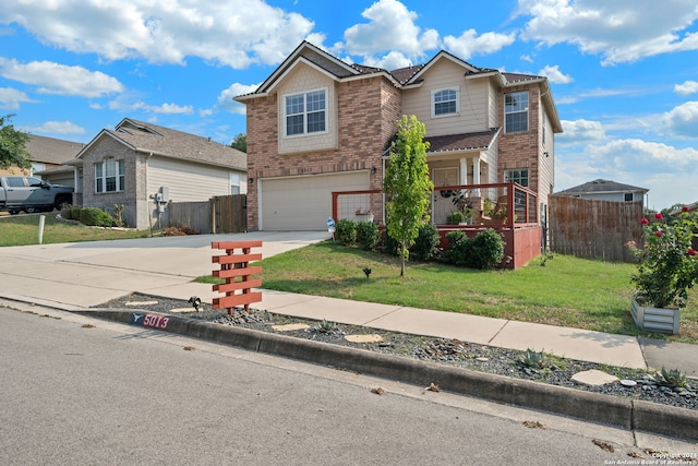 front facade featuring a front yard and a garage