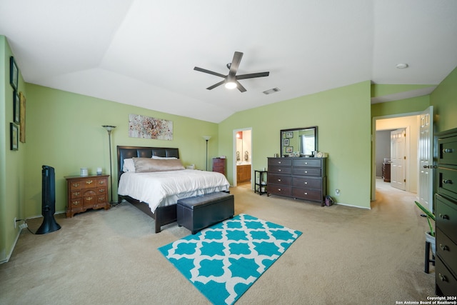 bedroom featuring ceiling fan, connected bathroom, carpet flooring, and lofted ceiling