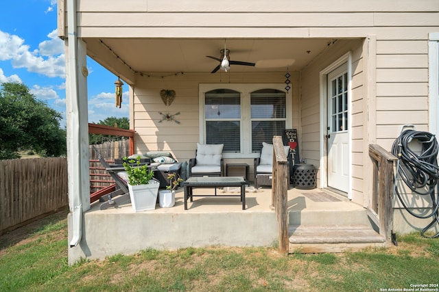 view of terrace featuring ceiling fan and an outdoor living space