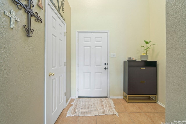 entrance foyer with light tile floors