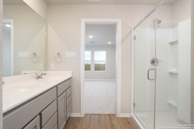 bathroom featuring walk in shower, tile flooring, large vanity, and ceiling fan